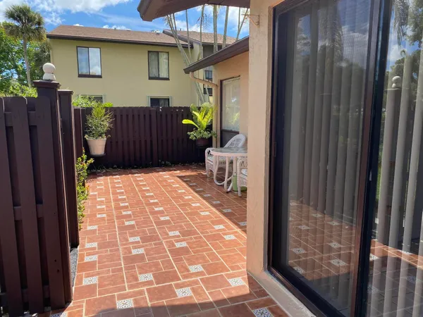 a view of a porch with wooden floor