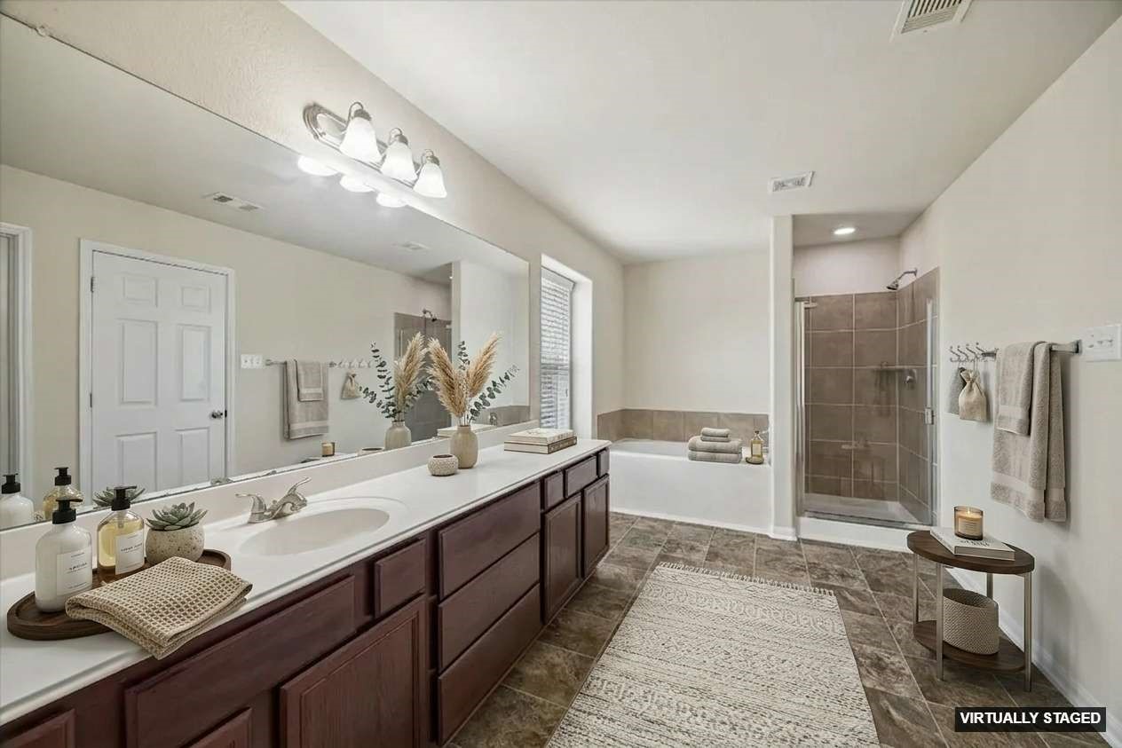 15642 South Fall Fern Circle Houston, TX 77044 - Photo 20 of 32 a spacious bathroom with a double vanity sink double mirror and shower