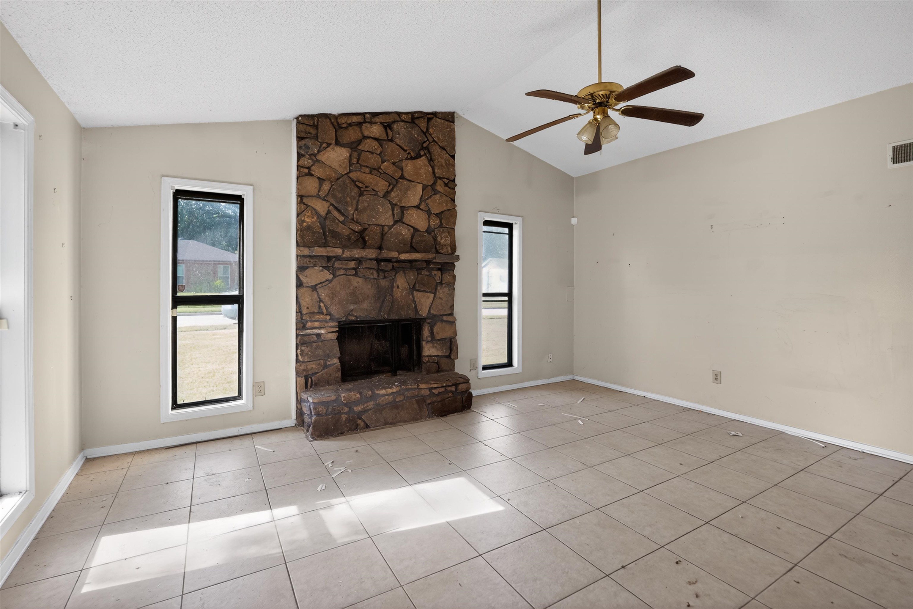 3372 Spring Shadow Drive Memphis, TN 38118 - Photo 20 of 35 Spacious living area featuring a vaulted ceiling and a stone fireplace