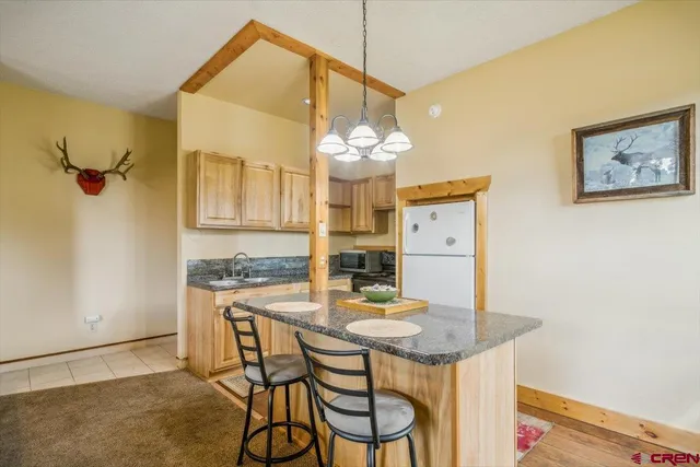 a dining room with a table and chairs