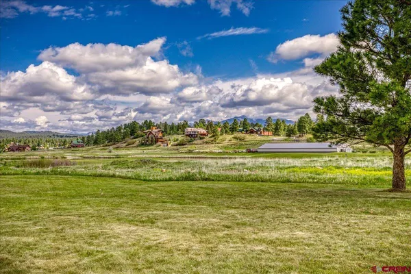 a view of a lake with a big yard