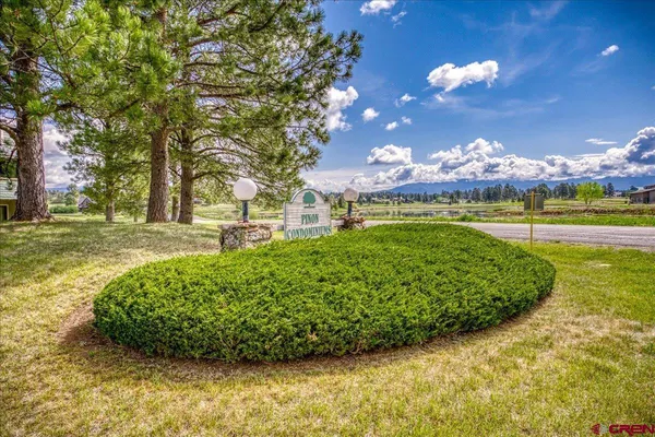 a view of a golf course with a lake view