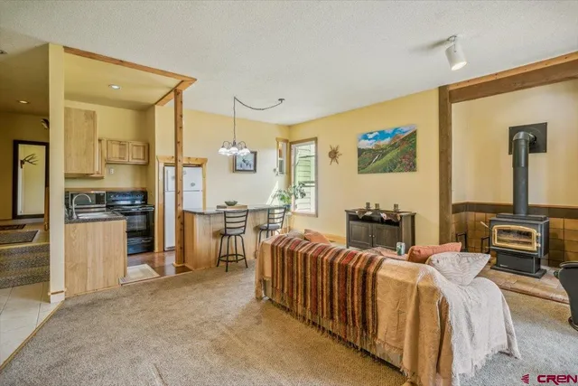 a bedroom with furniture and a flat screen tv