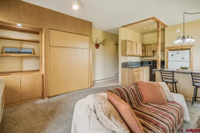 a bedroom with a bed and cabinets