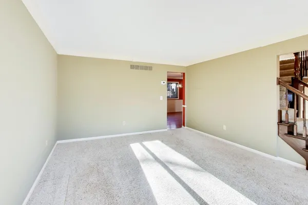a bedroom with a bed and a book shelf