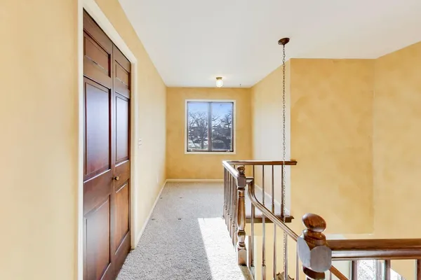 a view of a hallway with windows