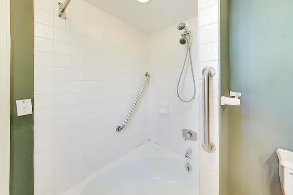 a bathroom with a glass shower door