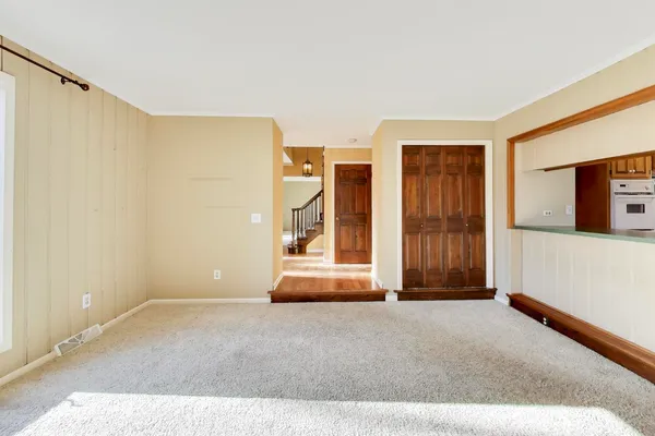 a view of an empty room with a fireplace