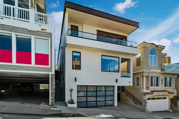 a front view of a house with a garage