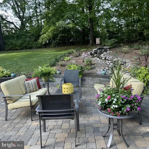 a kitchen with stainless steel appliances a sink a counter space and a window