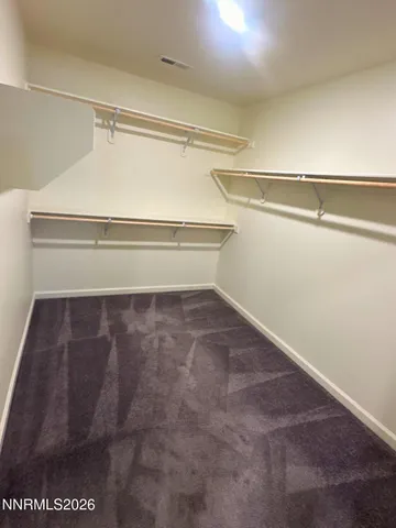 a view of a room with racks on the wall