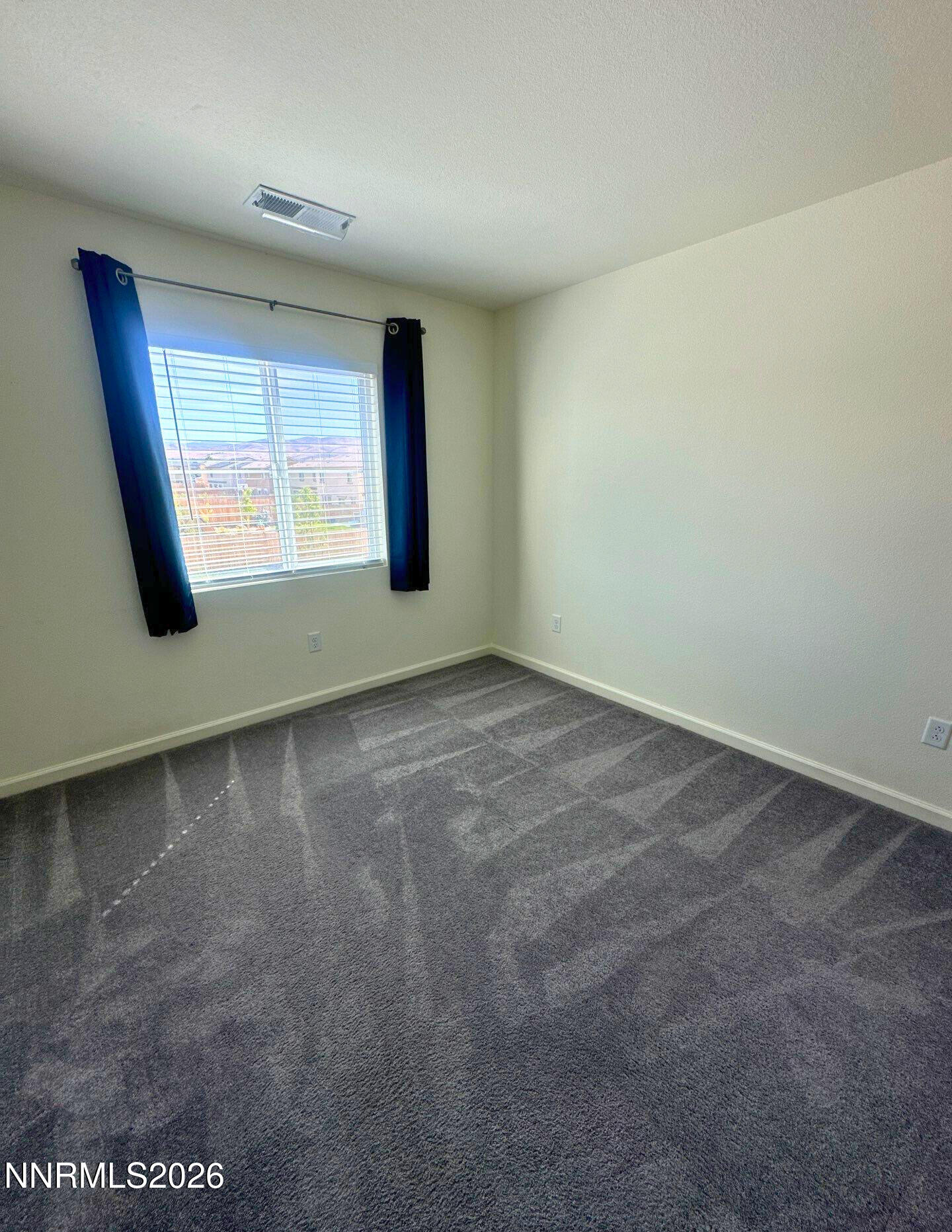 9007 Quail Grove Drive Reno, NV 89506 - Photo 13 of 18 an empty room with a window