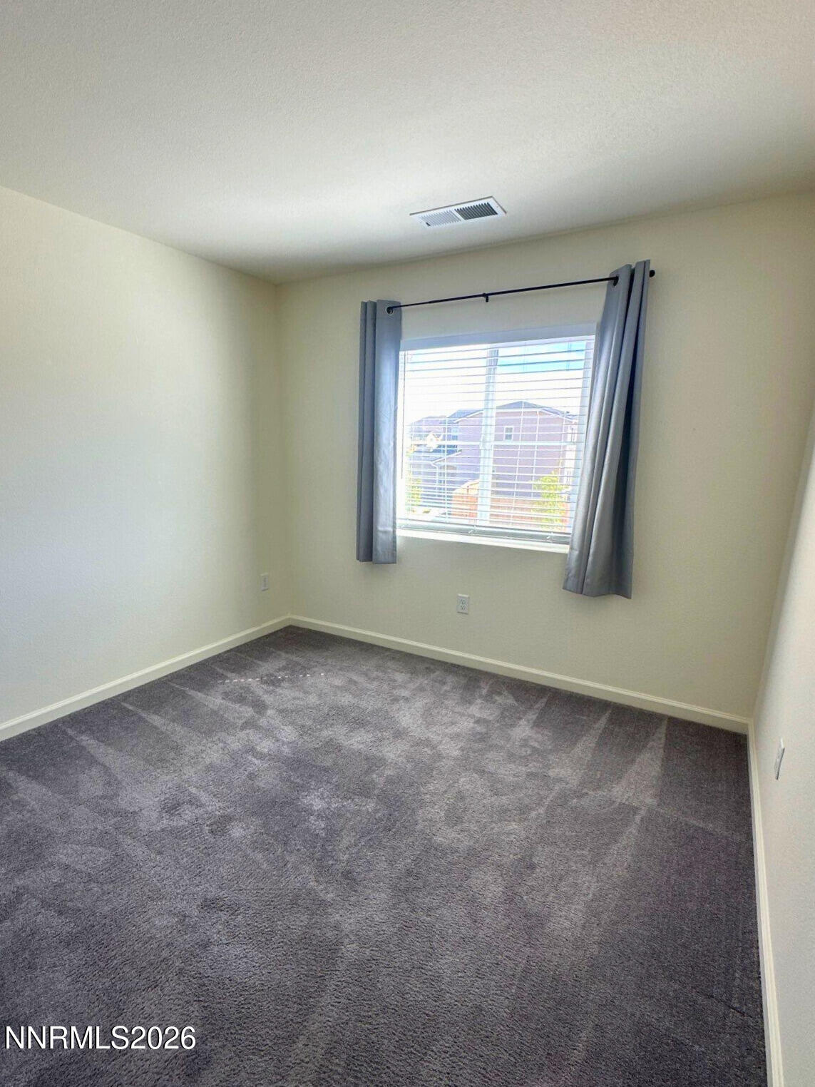 9007 Quail Grove Drive Reno, NV 89506 - Photo 15 of 18 an empty room with a window