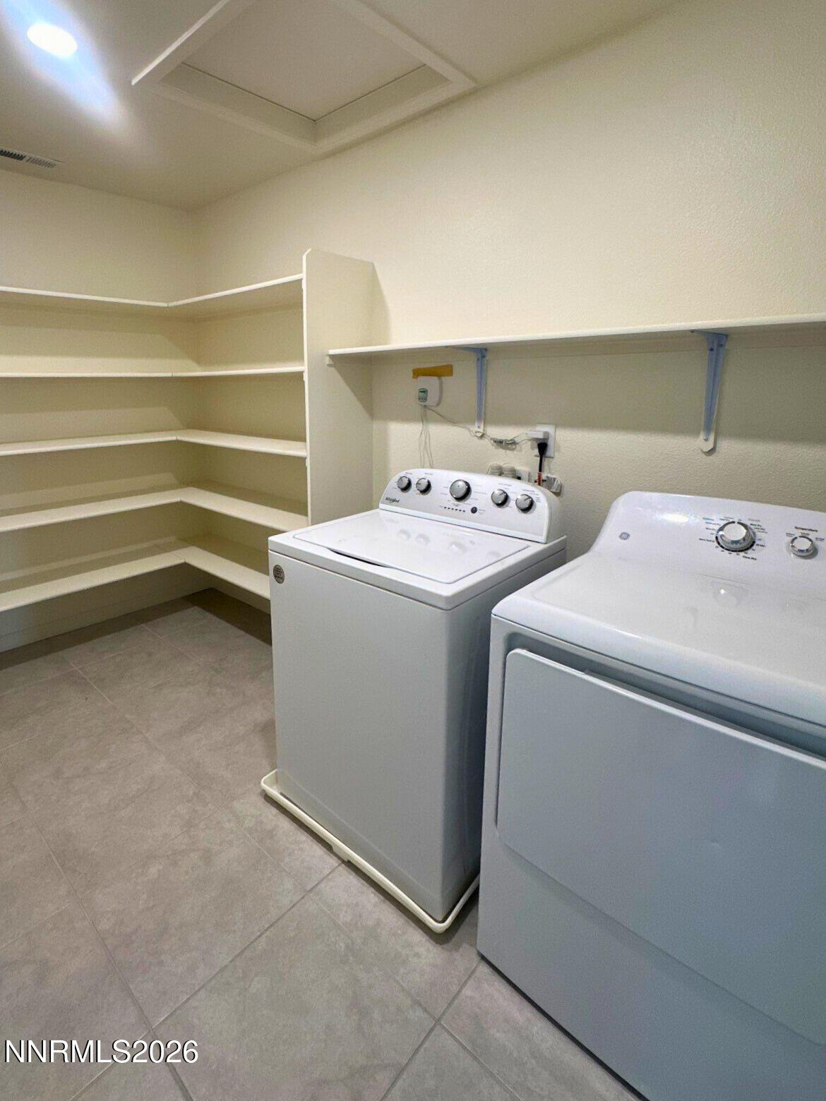 9007 Quail Grove Drive Reno, NV 89506 - Photo 16 of 18 a utility room with dryer and washer