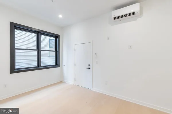 a view of an empty room with a window