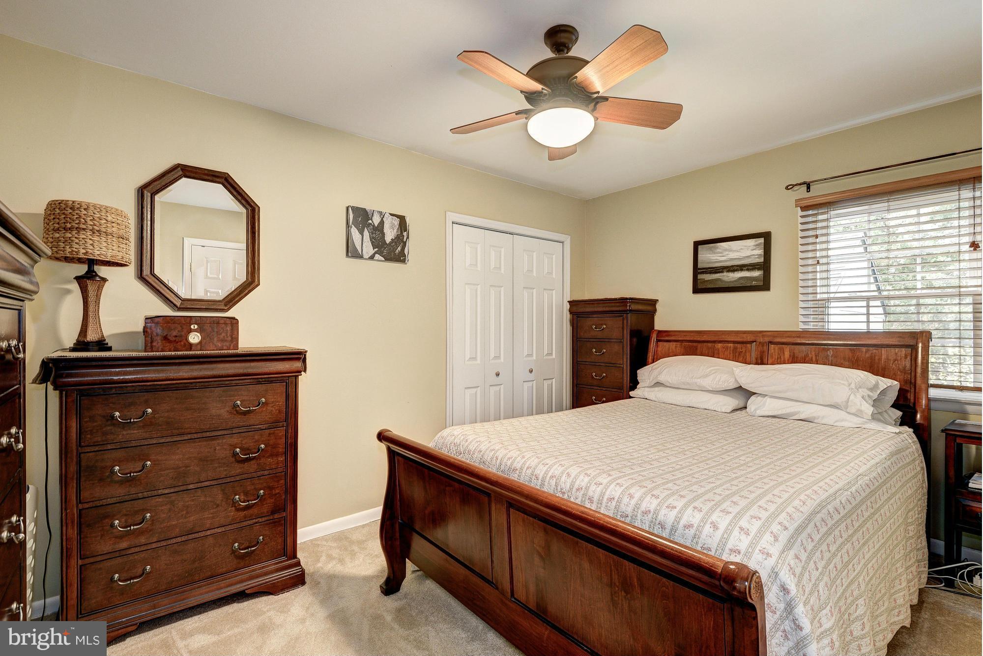 2034 Griffith Road Falls Church, VA 22043 - Photo 13 of 25 a bedroom with a bed and a chandelier
