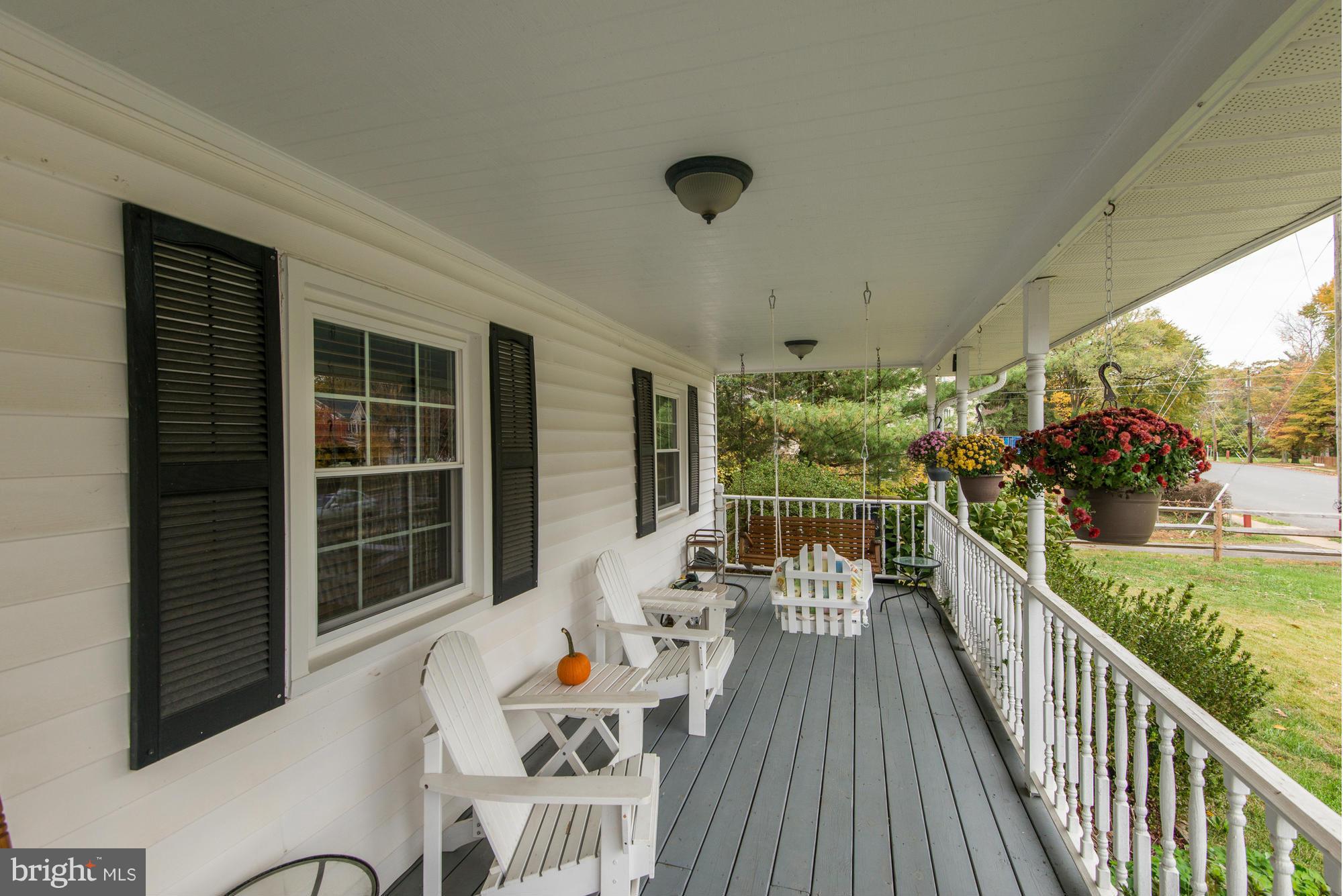 2034 Griffith Road Falls Church, VA 22043 - Photo 3 of 25 a view of a balcony dining table and chairs with wooden floor