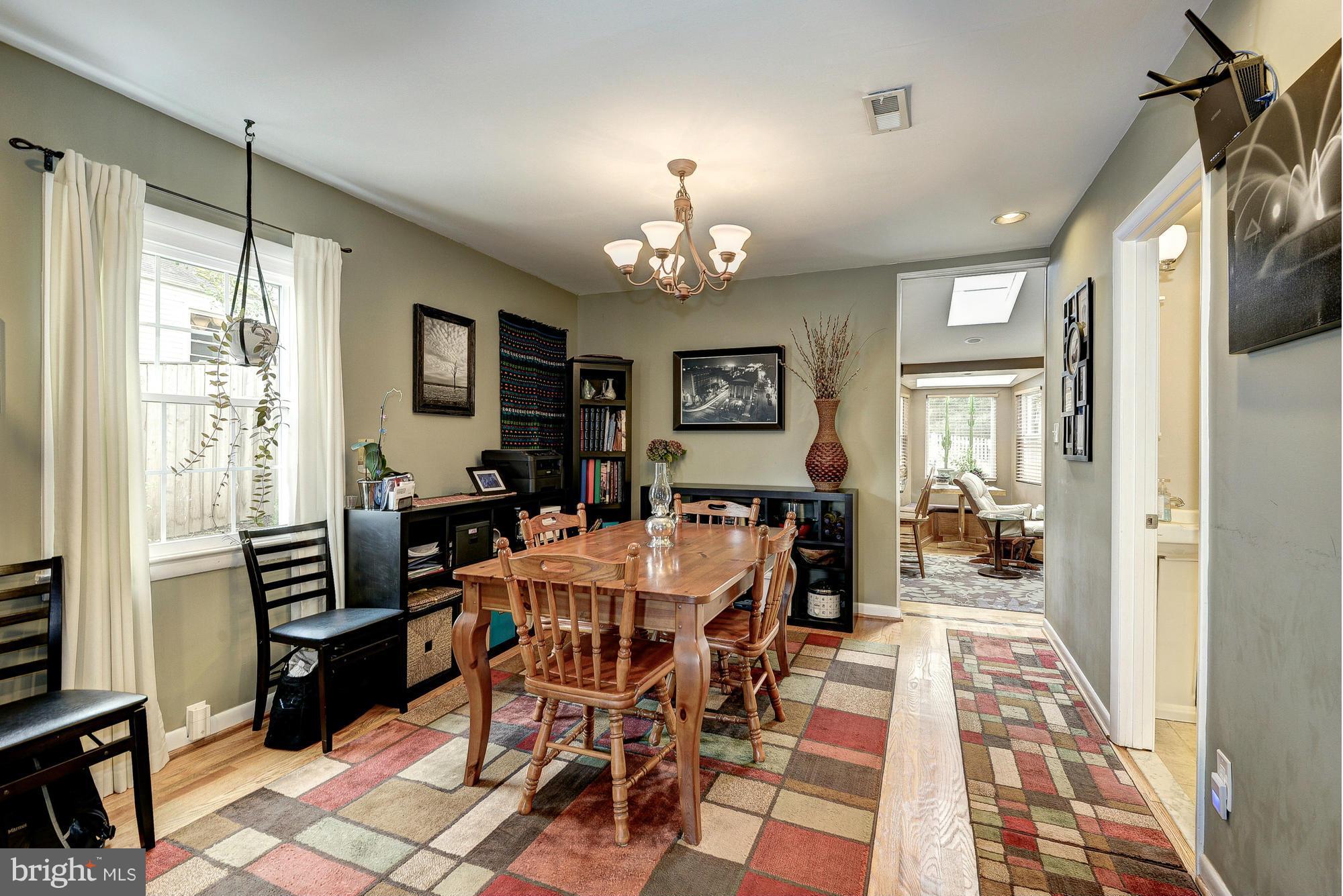 2034 Griffith Road Falls Church, VA 22043 - Photo 6 of 25 a view of a dining room with furniture window and wooden floor