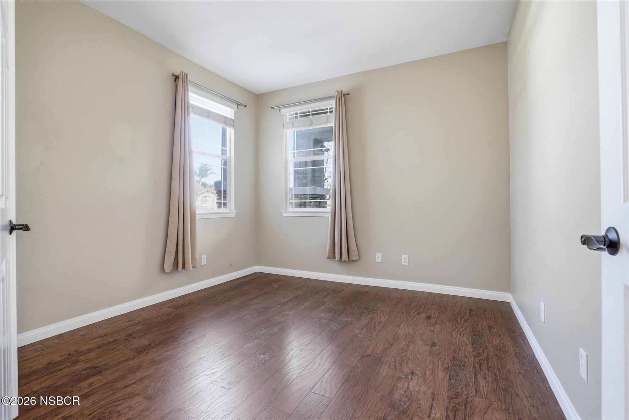 280 Rinconcito Lompoc, CA 93436 - Photo 21 of 52 an empty room with wooden floor and windows