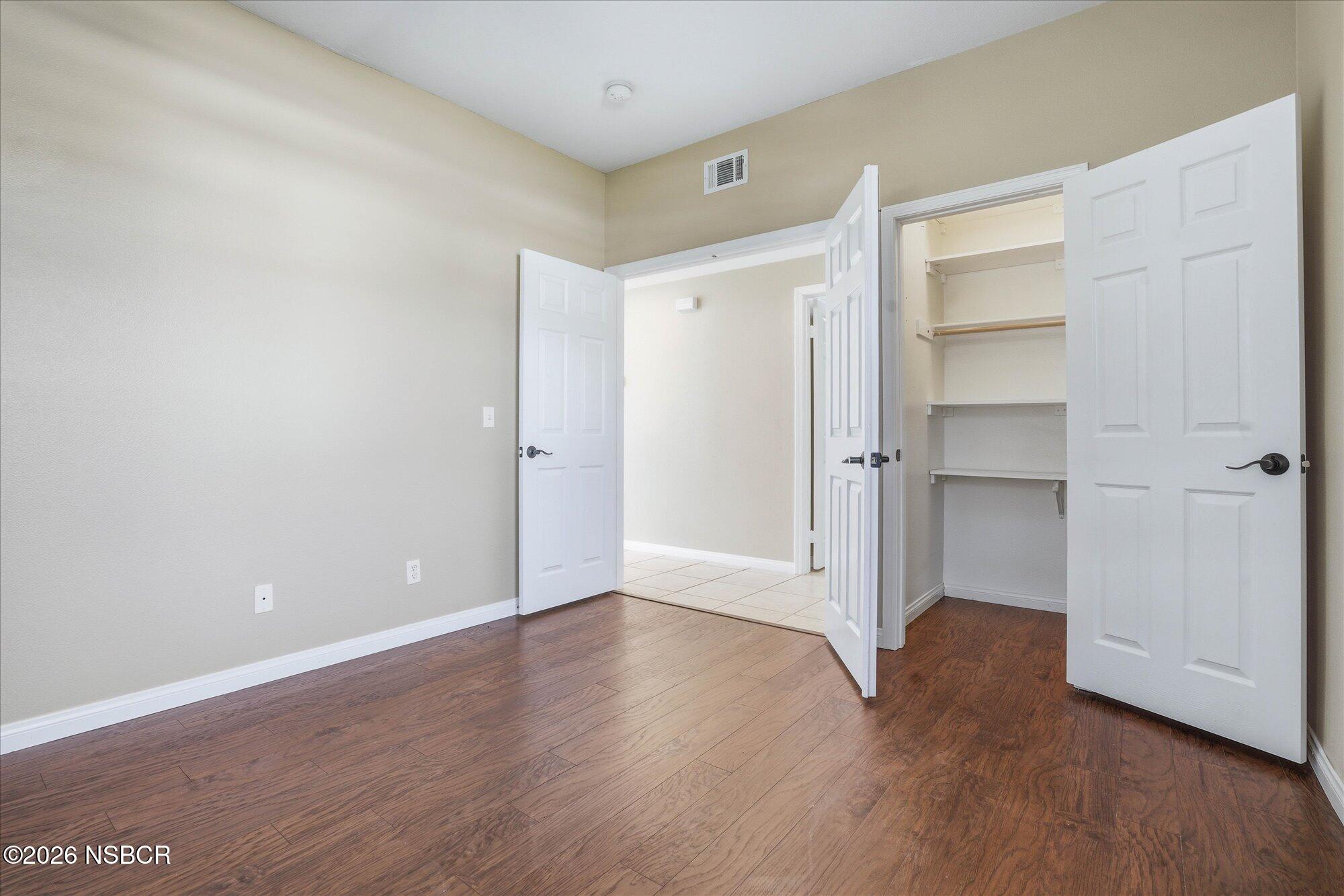 280 Rinconcito Lompoc, CA 93436 - Photo 22 of 52 a view of an empty room with closet and wooden floor