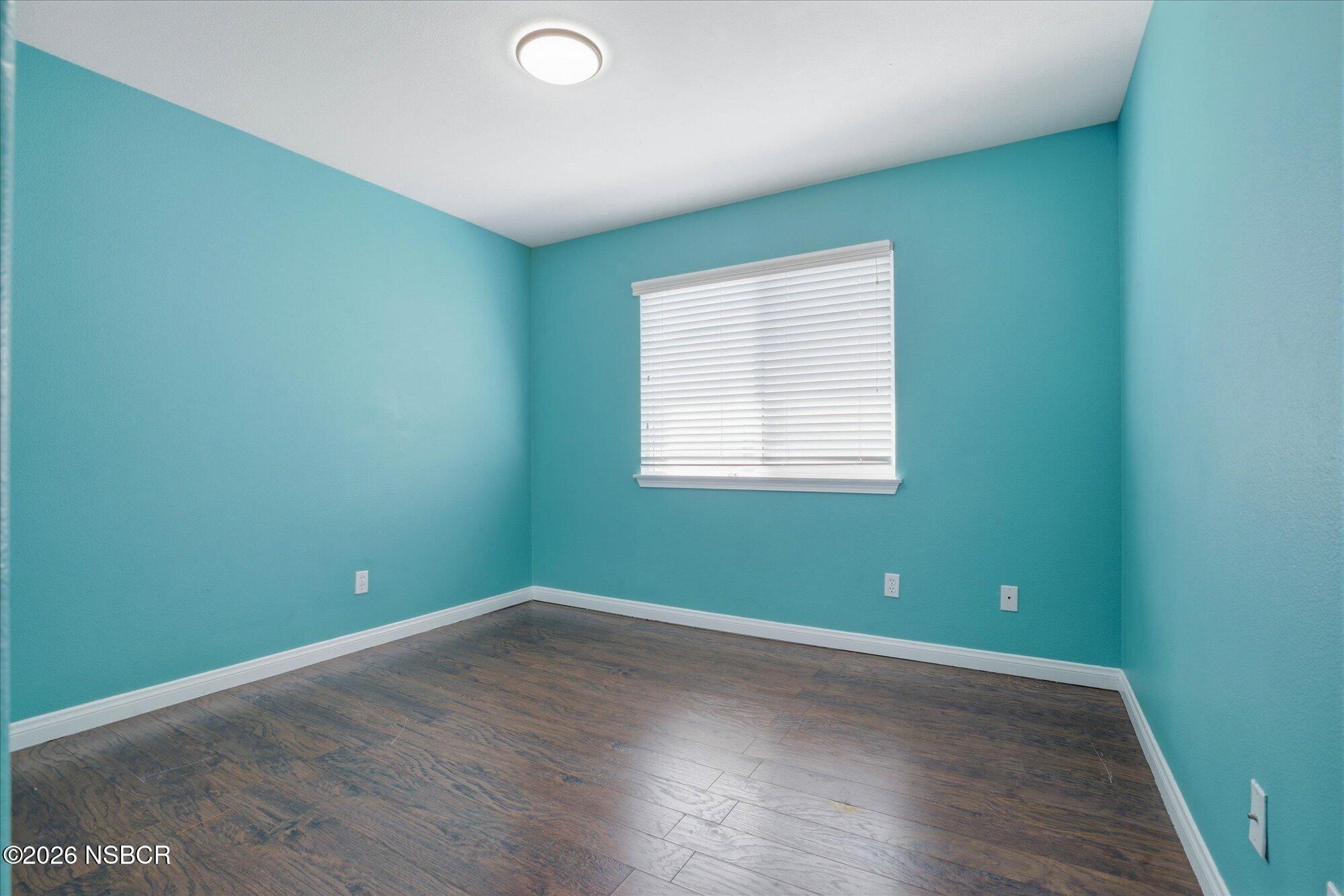 280 Rinconcito Lompoc, CA 93436 - Photo 32 of 52 an empty room with wooden floor and windows