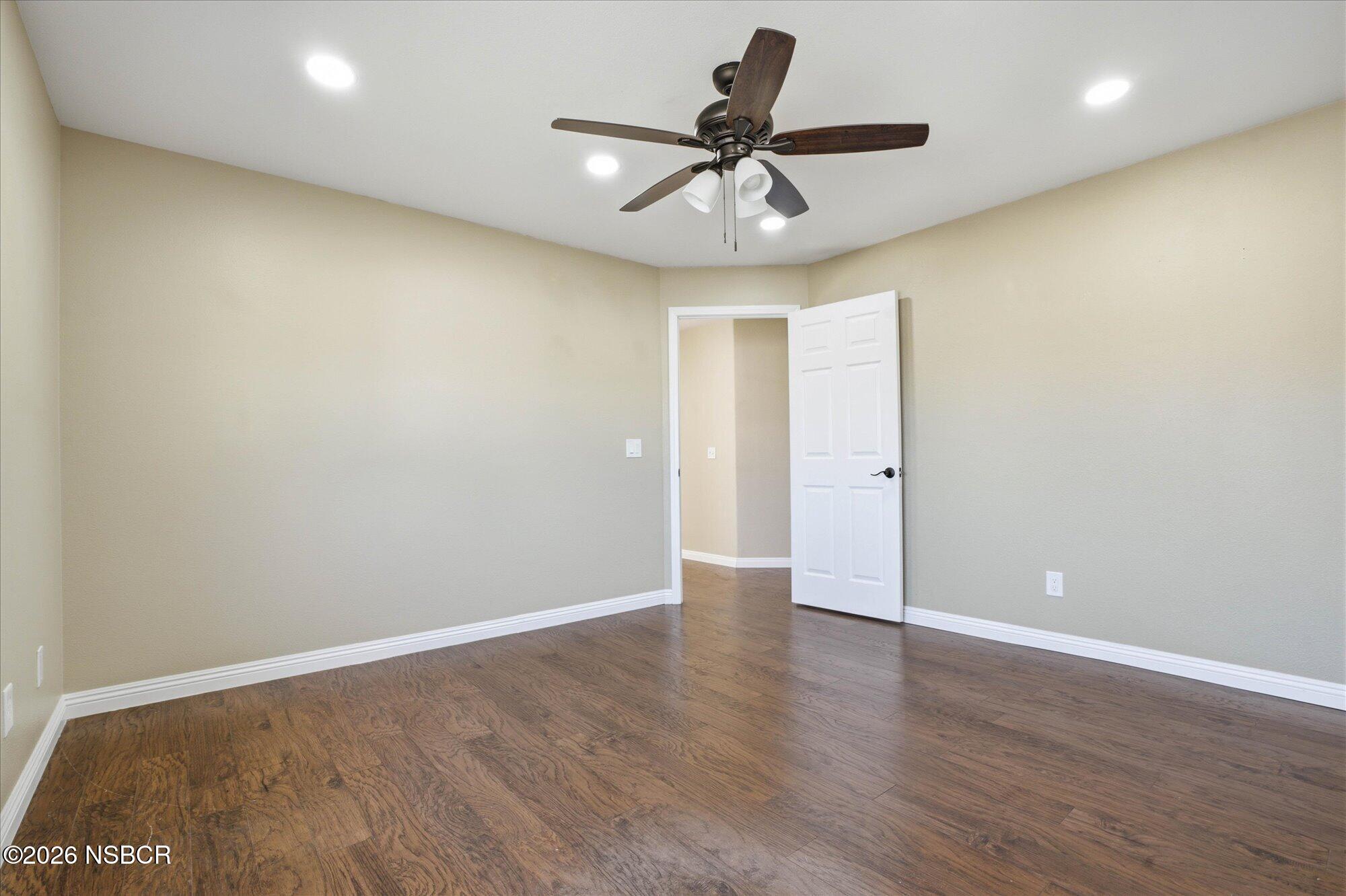 280 Rinconcito Lompoc, CA 93436 - Photo 34 of 52 an empty room with wooden floor and ceiling fan