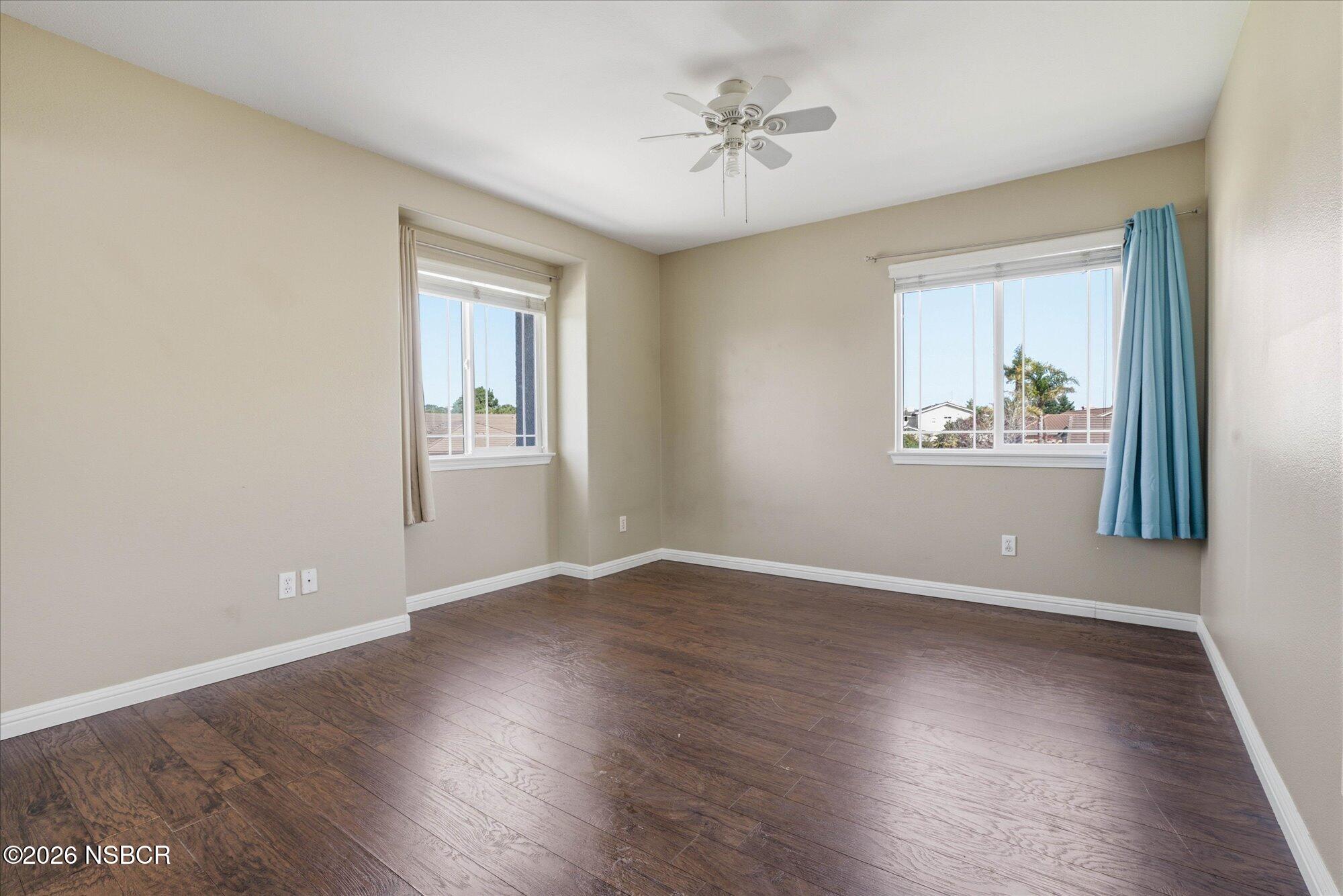280 Rinconcito Lompoc, CA 93436 - Photo 36 of 52 a view of an empty room with wooden floor and a window