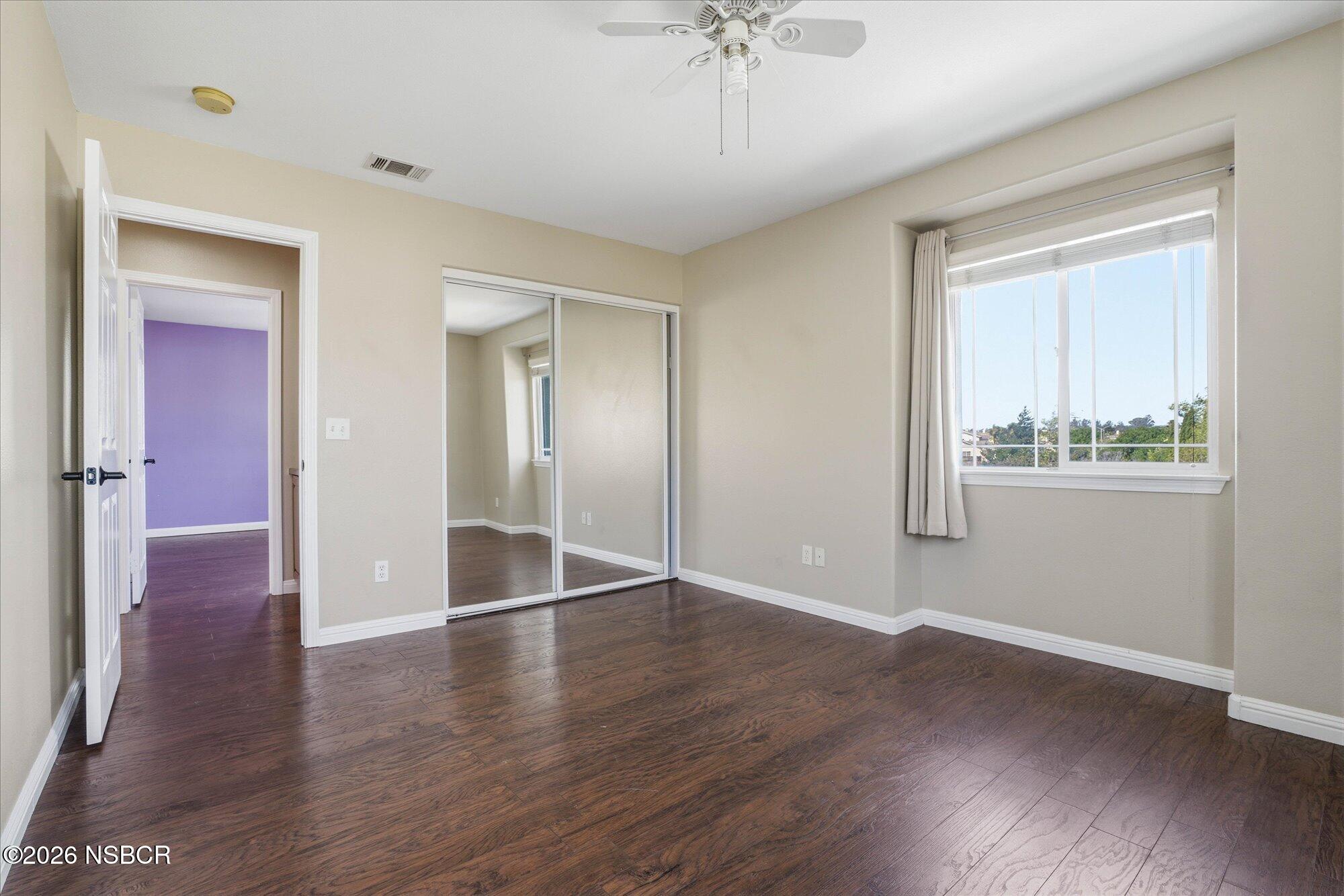 280 Rinconcito Lompoc, CA 93436 - Photo 37 of 52 a view of an empty room with wooden floor and a window