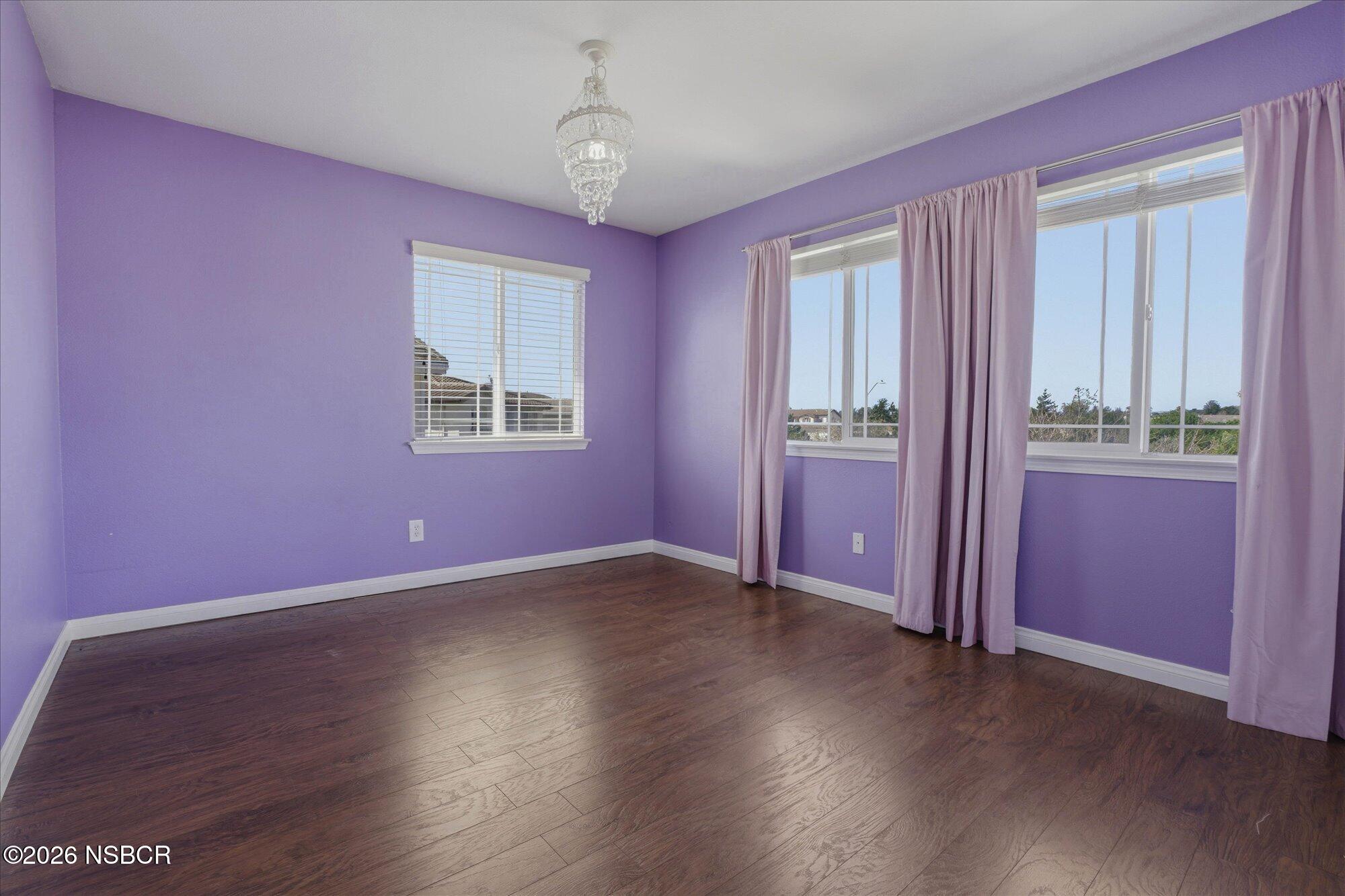 280 Rinconcito Lompoc, CA 93436 - Photo 38 of 52 a view of an empty room with window and wooden floor