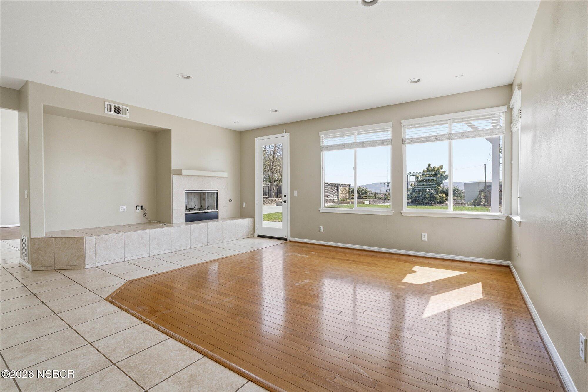 280 Rinconcito Lompoc, CA 93436 - Photo 9 of 52 a view of an empty room with wooden floor and a window