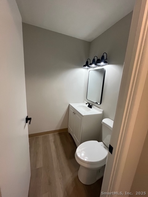 79 Beths Avenue, Unit 100 Bristol, CT 06010 - Photo 16 of 29 a bathroom with a toilet and a mirror