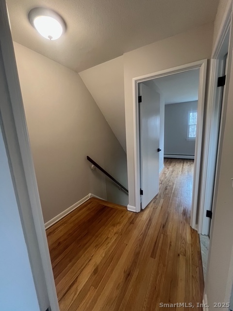 79 Beths Avenue, Unit 100 Bristol, CT 06010 - Photo 17 of 29 a view of hallway with wooden floor