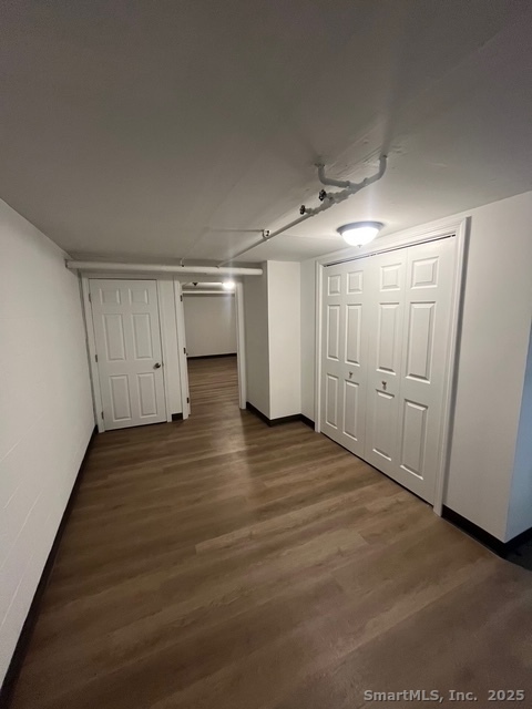 79 Beths Avenue, Unit 100 Bristol, CT 06010 - Photo 22 of 29 a view of empty room with wooden floor