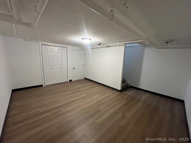 79 Beths Avenue, Unit 100 Bristol, CT 06010 - Photo 28 of 29 wooden floor in an empty room