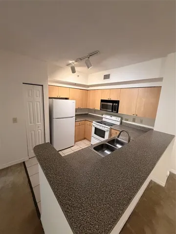 a kitchen with a sink a counter top space