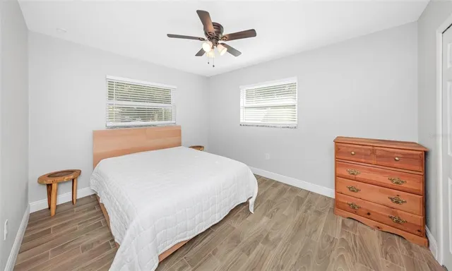 a bedroom with a bed and a dresser