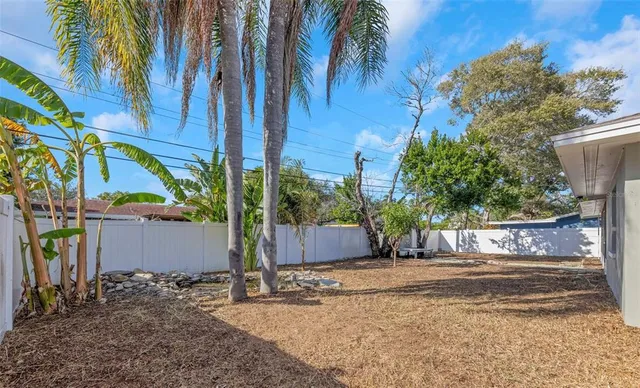 a view of a house with a yard and garage