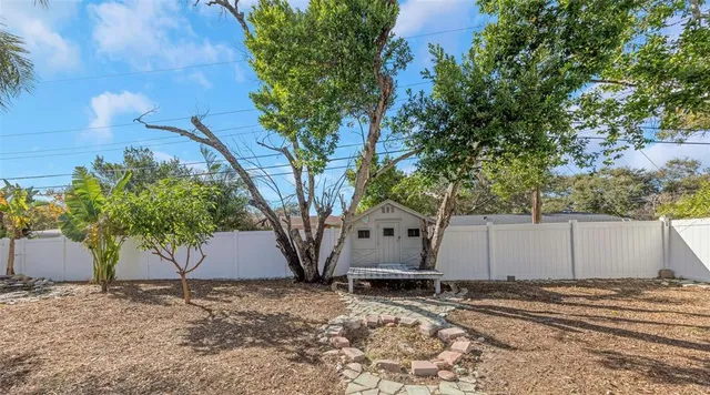 a house view with a backyard space