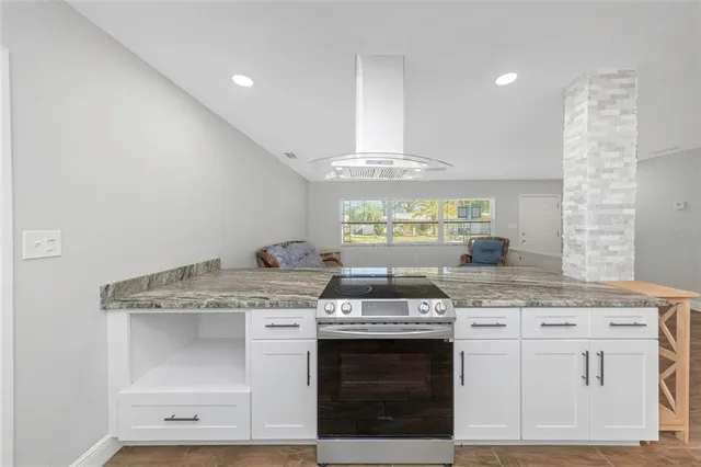a kitchen with a stove and a sink