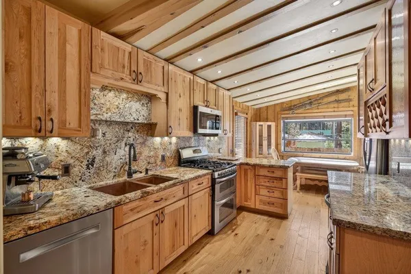 an empty room with furniture and a ceiling fan