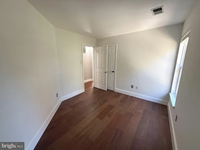 a view of a pathway of a house with backyard