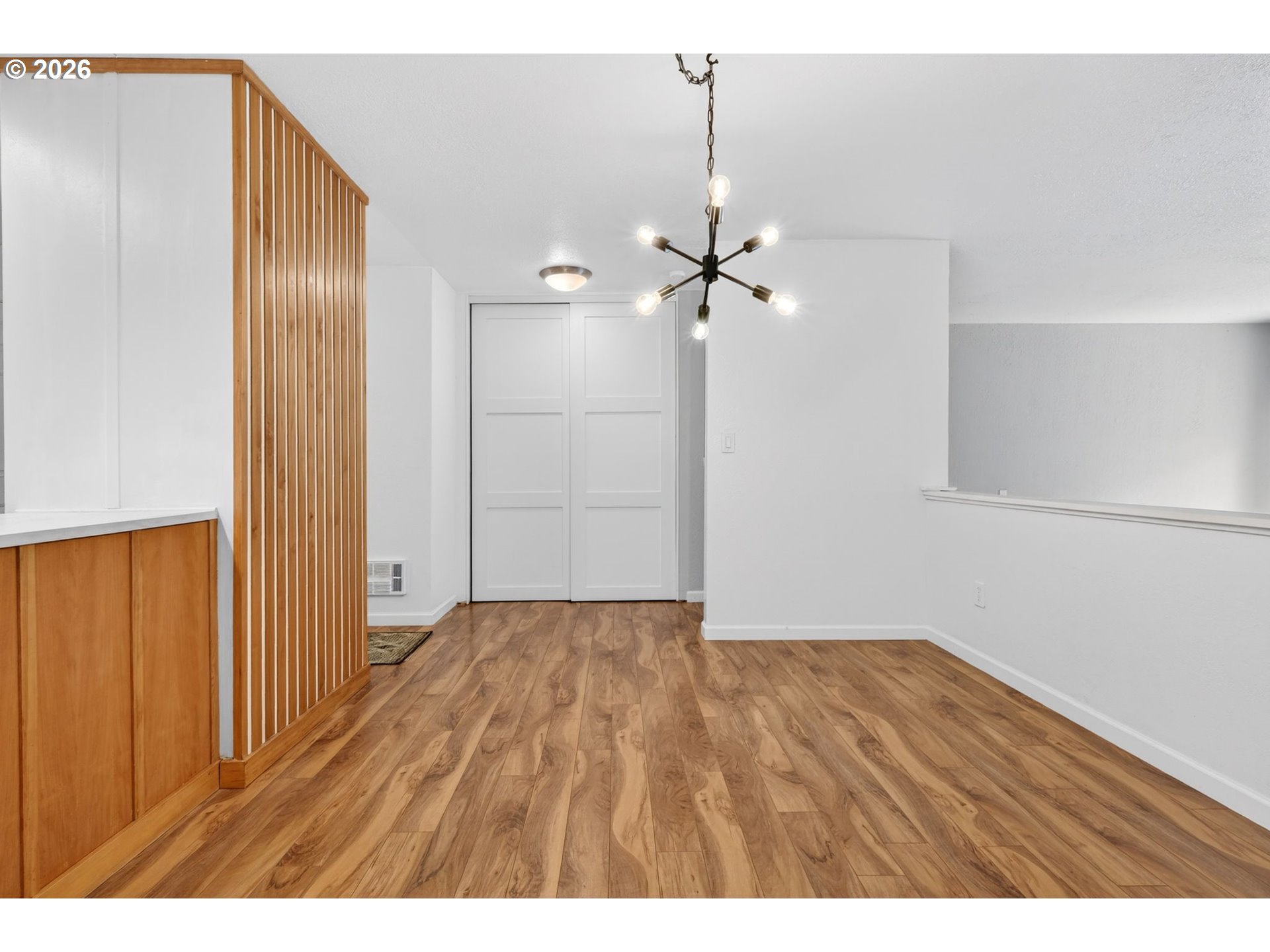 4 Touchstone, Unit 151 Lake Oswego, OR 97035 - Photo 11 of 28 a view of an empty room with wooden floor