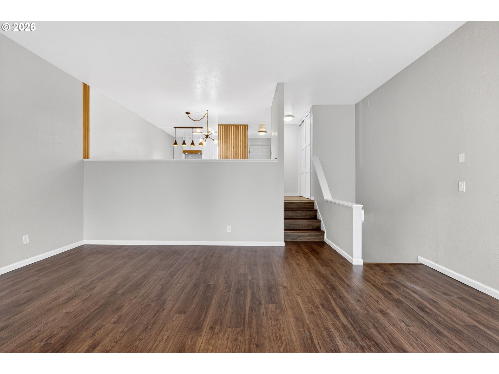 4 Touchstone, Unit 151 Lake Oswego, OR 97035 - Photo 13 of 28 a view of a hallway with wooden floor