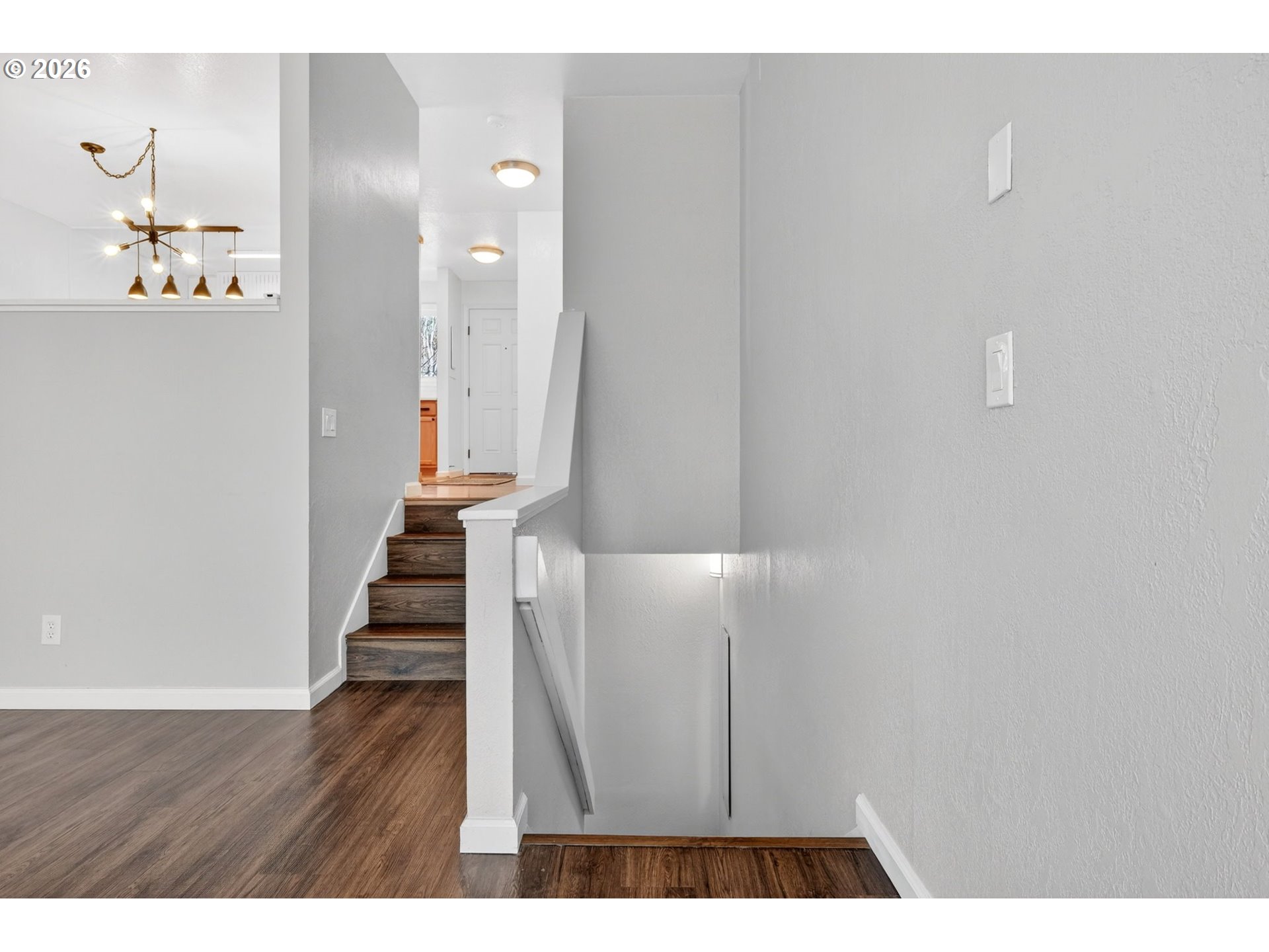 4 Touchstone, Unit 151 Lake Oswego, OR 97035 - Photo 14 of 28 a view of a hallway with wooden floor and staircase
