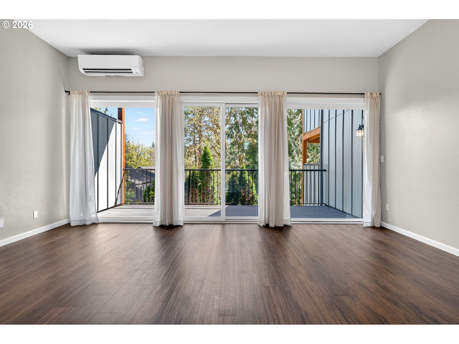 4 Touchstone, Unit 151 Lake Oswego, OR 97035 - Photo 15 of 28 a view of an empty room with wooden floor and a window
