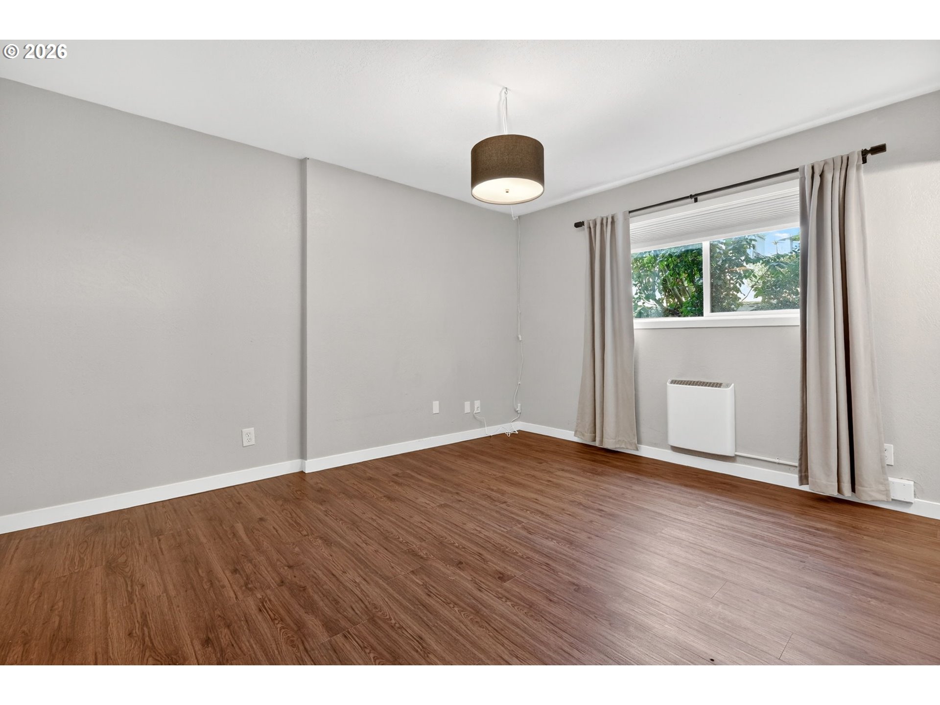 4 Touchstone, Unit 151 Lake Oswego, OR 97035 - Photo 18 of 28 an empty room with wooden floor and windows