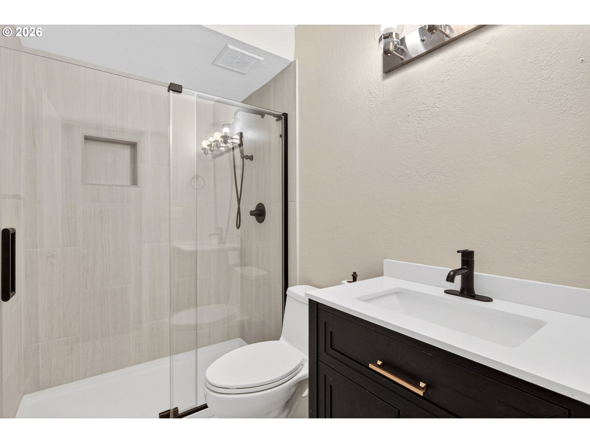4 Touchstone, Unit 151 Lake Oswego, OR 97035 - Photo 19 of 28 a bathroom with a sink a toilet a shower and a mirror