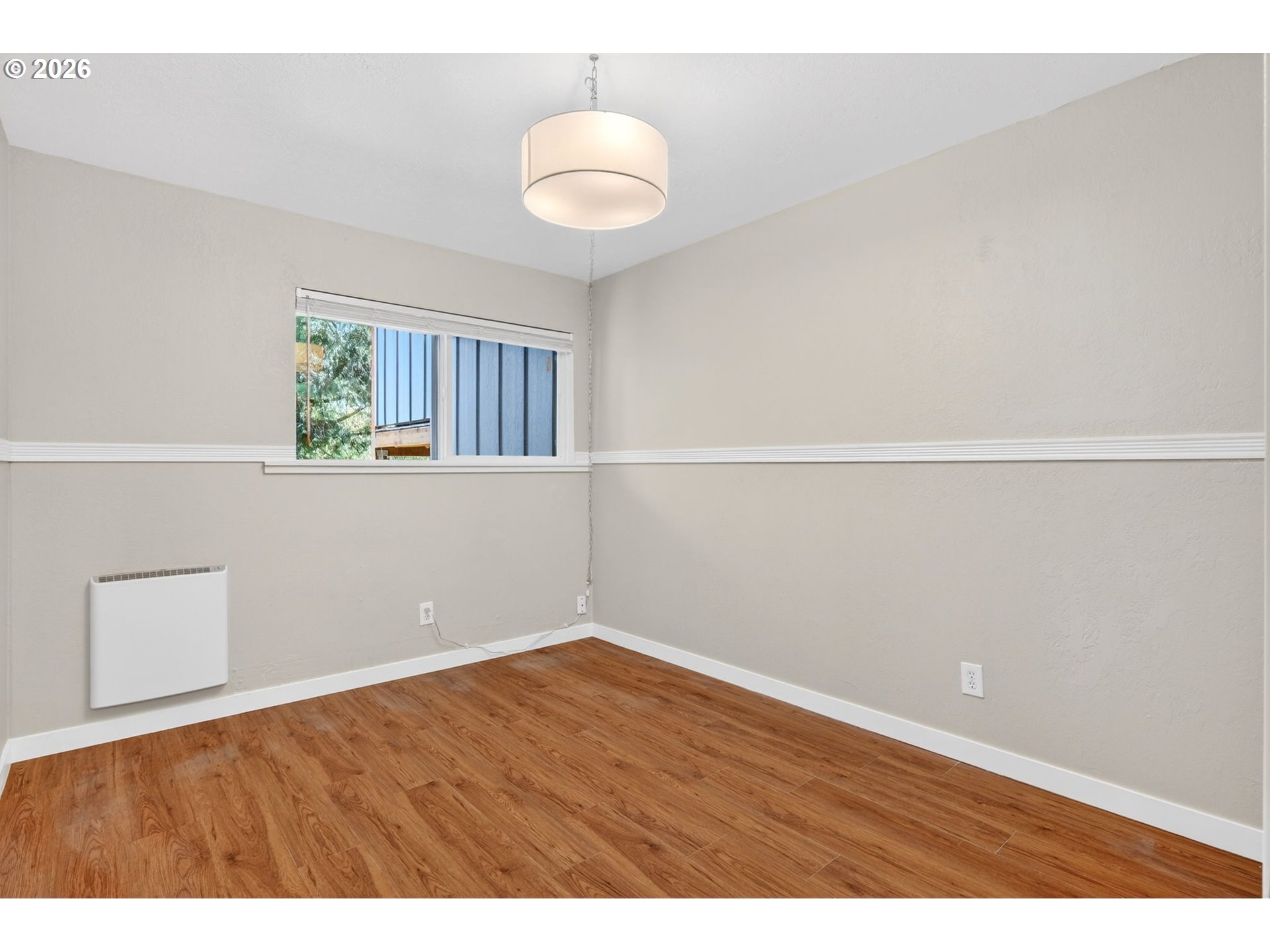 4 Touchstone, Unit 151 Lake Oswego, OR 97035 - Photo 25 of 28 a view of an empty room with wooden floor and a window