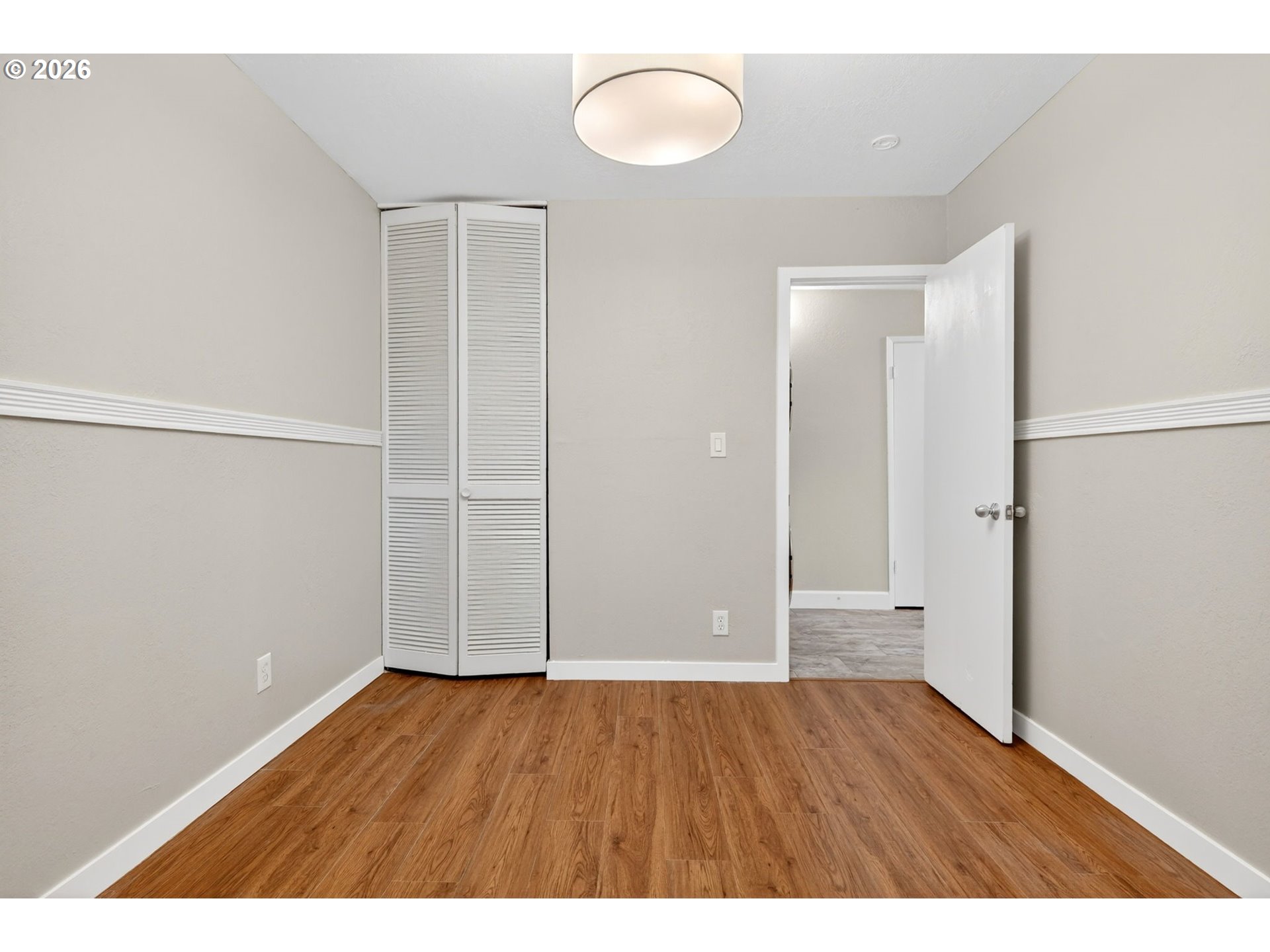 4 Touchstone, Unit 151 Lake Oswego, OR 97035 - Photo 26 of 28 an empty room with wooden floor
