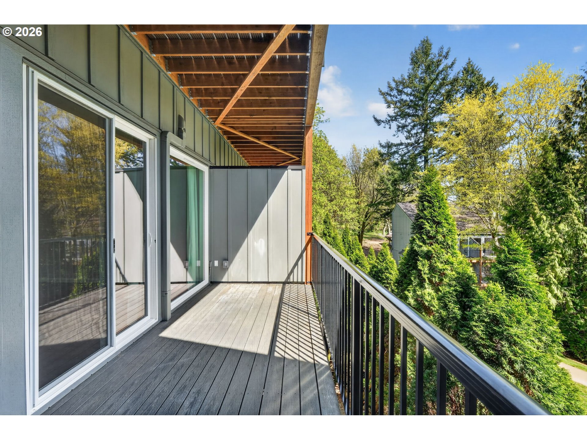 4 Touchstone, Unit 151 Lake Oswego, OR 97035 - Photo 27 of 28 a view of balcony with wooden floor and fence
